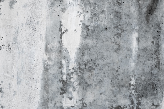 Abstract concrete wall background, grunge texture of old gray stone. Architecture rough backdrop. Cement, white plaster wallpaper. Urban monochrome painted surface of building.