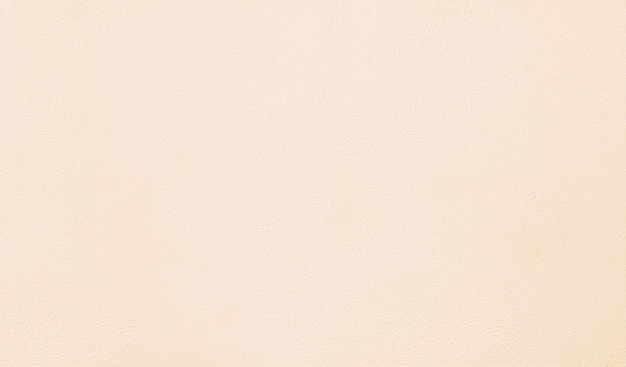 Photo abstract cream color clean cement wall background,