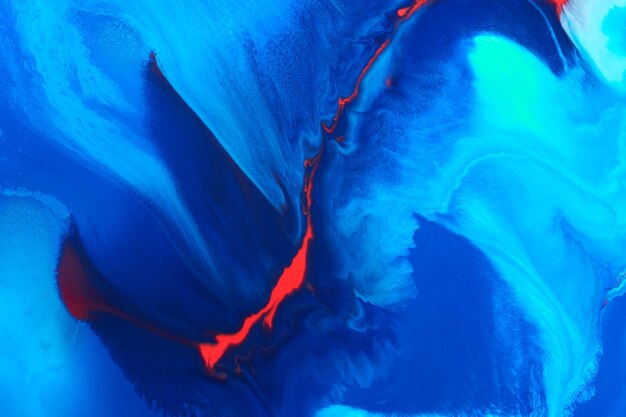 Abstract creative background liquid art contrast paint stains and blots blue red alcohol ink