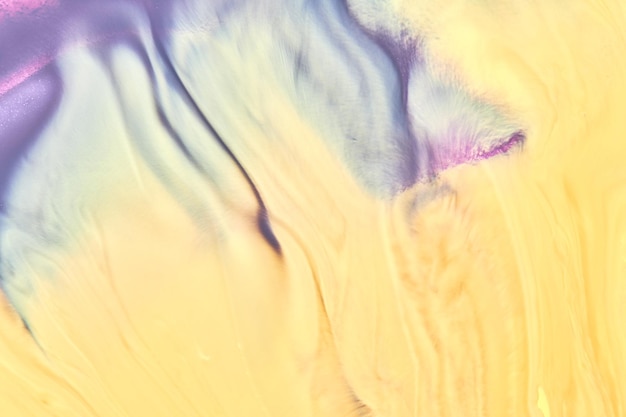 Abstract creative background liquid art contrast paint stains and blots yellow purple alcohol ink