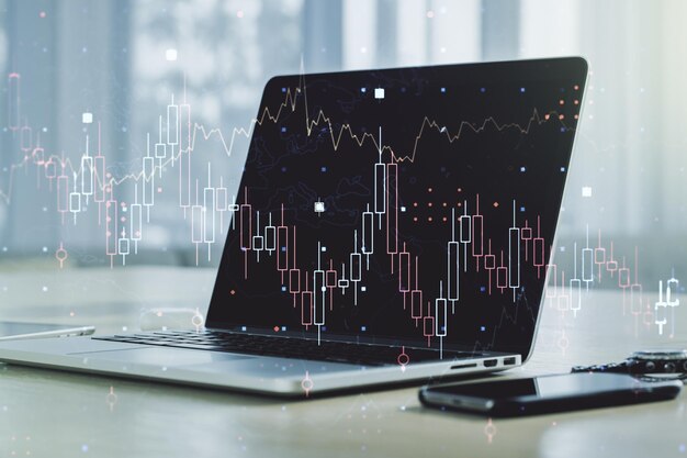 Abstract creative financial graph on modern laptop background forex and investment concept Multiexposure