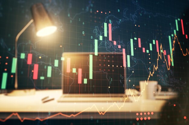 現代のコンピューターの背景に世界地図を含む抽象的な創造的な財務グラフ金融と取引の概念多重露光