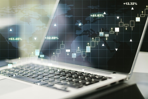 現代のコンピューターの背景に世界地図を使用した抽象的な創造的な金融グラフ金融および取引の概念