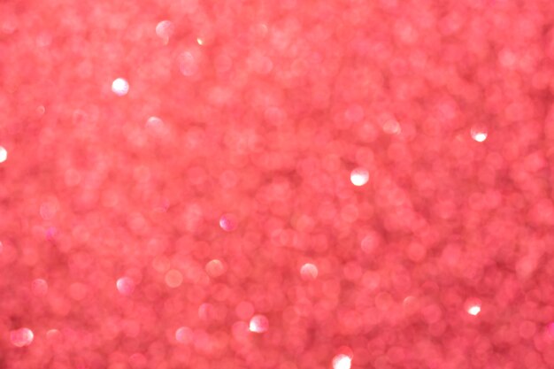 Fondo vago rosso cremisi astratto del bokeh. luci brillanti scintillanti. sfondo festivo e celebrativo per il design di vacanze, natale e capodanno, stock photo