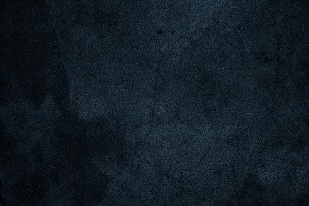 Photo abstract dark blue grunge texture with scratches and spots on an old cement plaster wall for background