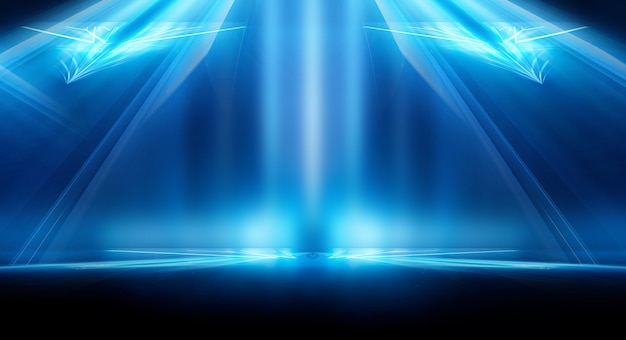 Abstract dark futuristic background Blue neon light rays reflect