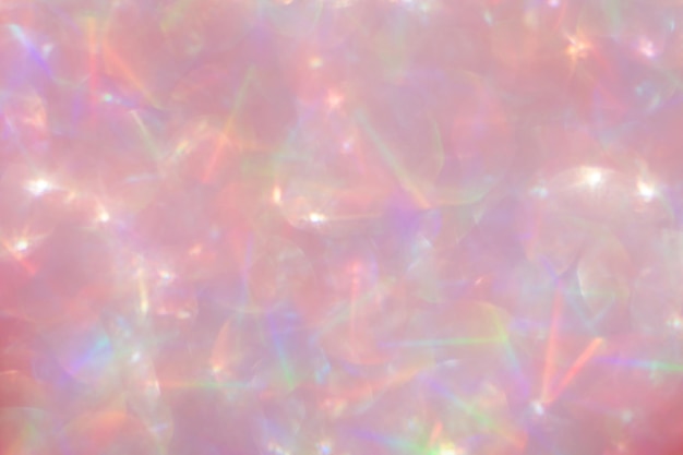 Abstract defocused pink background with shining glitter.Good as overlay layer.