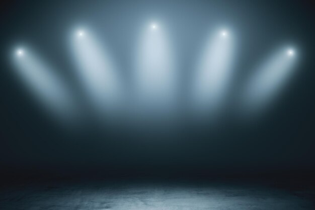 Фото Абстрактная пустая сцена с серыми дымчатыми прожекторами и бетонным полом в темной комнате