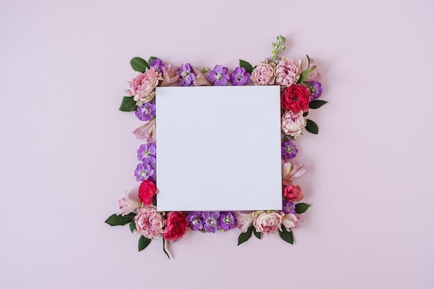 Abstract floral aesthetic background Floral frame wreath of colourful rose flowers on pink background with blank copy space mockup Beautiful flowers and petals template