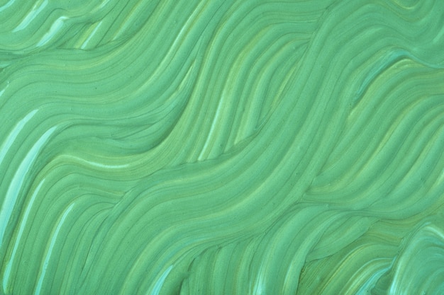 abstract fluid art background green colors acrylic painting with olive gradient with wavy pattern