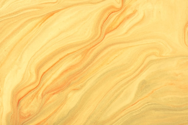 Abstract fluid art background light yellow and golden colors. Liquid marble. Acrylic painting with beige pearl gradient.