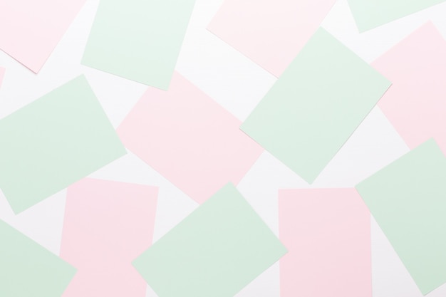 Abstract geometric background in light pastel tones from sheets of thick pale past paper.