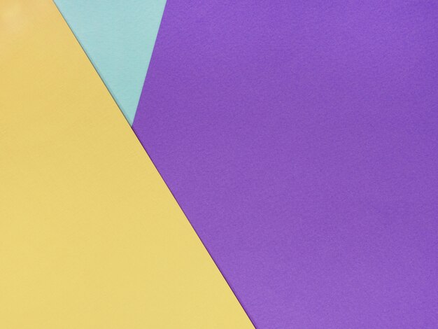 abstract geometric background of lilac yellow and blue sheets of watercolor paper