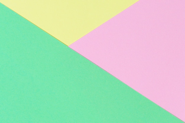 Abstract geometric shape pastel green pink and yellow color paper background