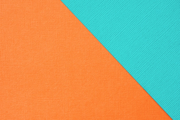 Abstract geometrisch turkoois en oranje textuurpapier als achtergrond.