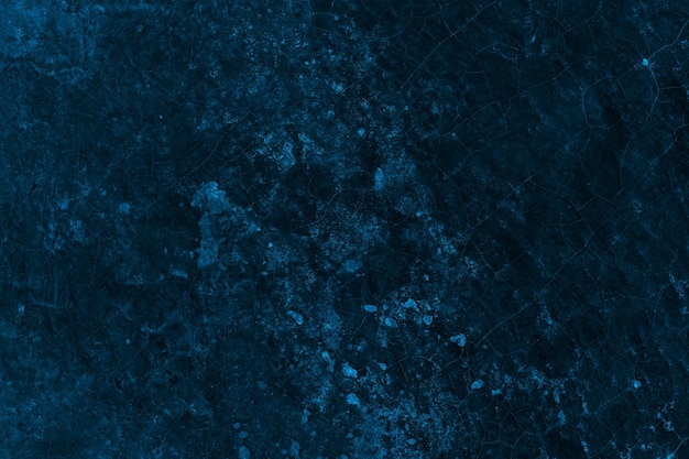 Abstract getextureerd donkerblauw betonnen muuroppervlak voor achtergrond