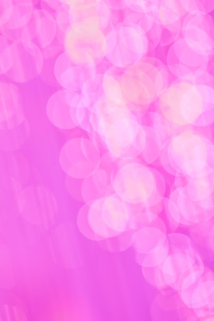 Abstract glitter pink rain motion defocused bokeh light background for cell phone display wallpaper or celebration and holiday card