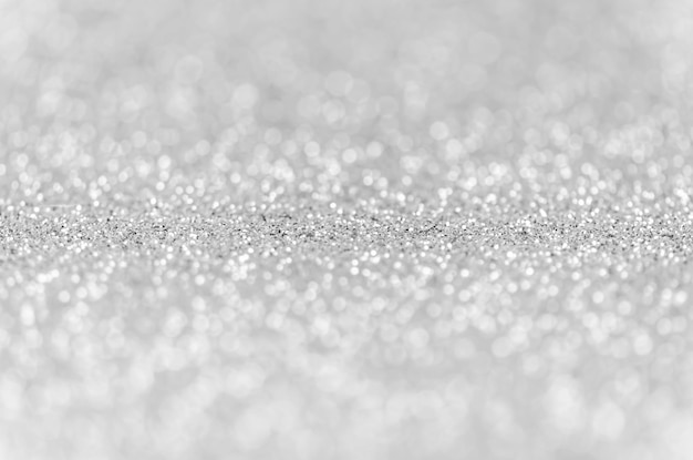 Photo abstract glitter silver lights background. de-focused. christmas