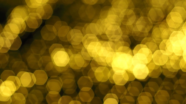 Abstract gold bokeh light on golden background. Christmas and New Year theme