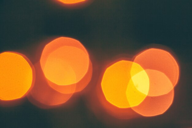 Abstract Gold bokeh sparkle on dark background