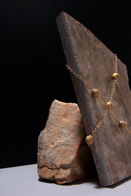 abstract gold chain jewellery presentation