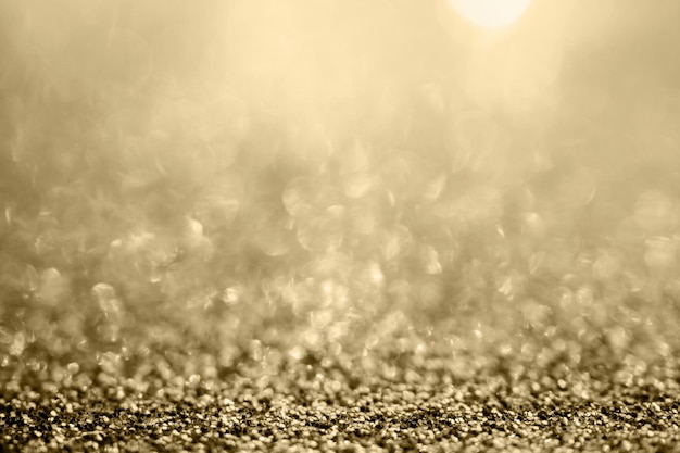 Abstract gold glitter sparkle blurred with bokeh background