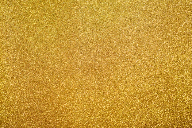 抽象的なゴールドラメの輝きテクスチャ背景