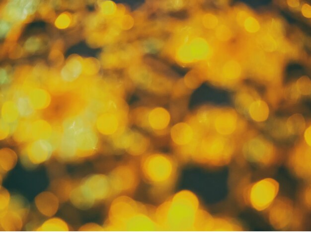 Abstract golden bokeh light on black background