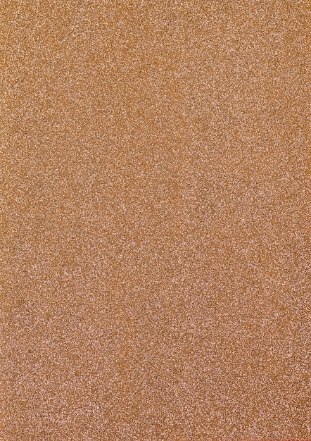 Abstract golden sparkles paper background.