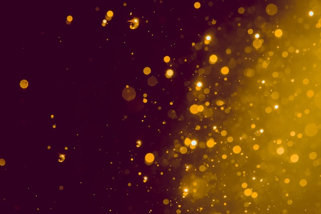 Foto abstract goud vervagen glitter bokeh op zwart