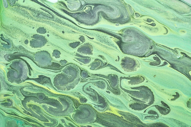 Abstract green color background Multicolored fluid art Waves splashes and blots acrylic alcohol ink paints under water