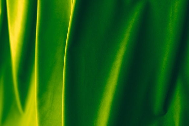 高級インテリア デザイン ブランドのブラインドやカーテンのファッション テクスチャと家の装飾の背景の抽象的な緑の布地背景ベルベット繊維材料