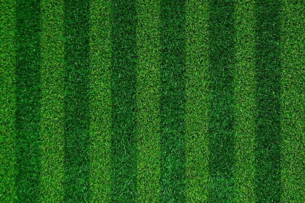 Абстрактное футбольное поле с зеленой травой из искусственной травы фоновой текстурыВид сверху