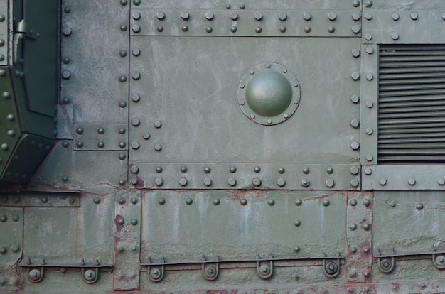 Abstract green industrial metal textured background with rivets and bolts