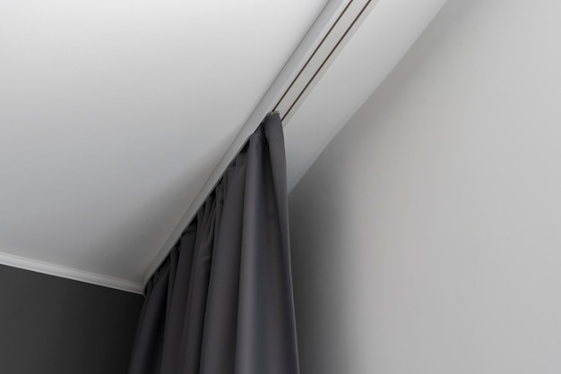 The abstract grey color curtains at home on white railings