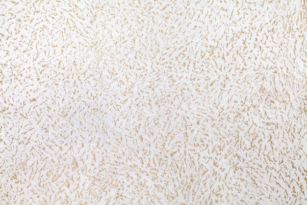 Photo abstract grunge seamless pattern with golden acrylic on white background