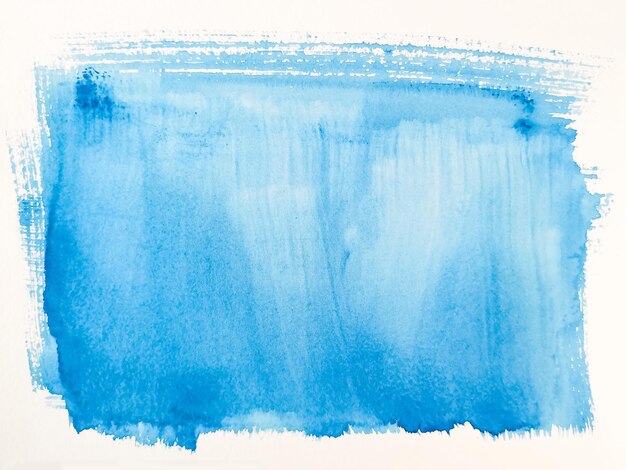 Abstract image of blue paint on white paper