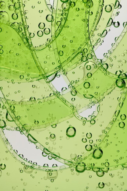 Photo abstract image of water drops on green glass