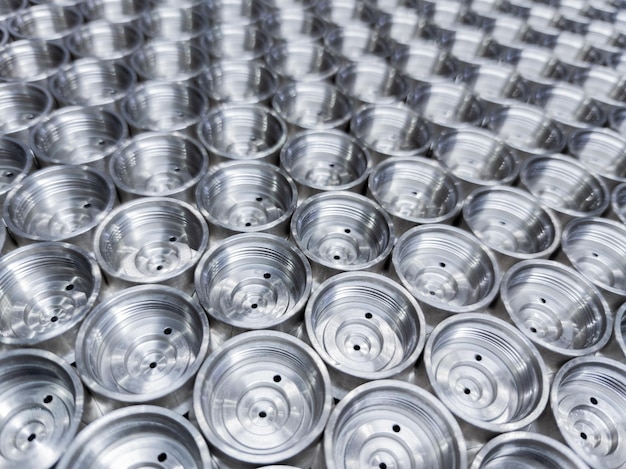 Abstract industrial closeup background of shiny steel turned parts