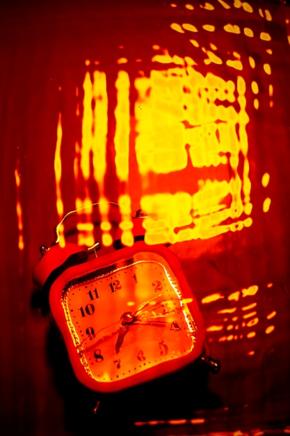 Abstract inferno background in red and orange with a clock