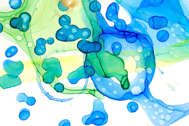 Abstract ink blue and green watercolor ink spots background alcohol ink illustration