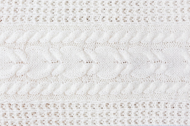 abstract knitted background. wool white sweater texture.