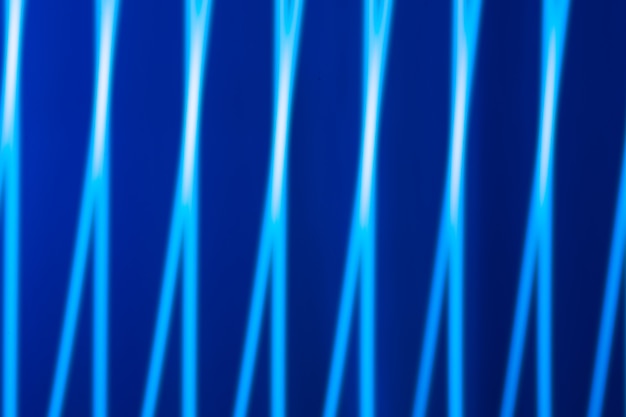 Abstract light background. Blue blured trail lights, strips and bokeh