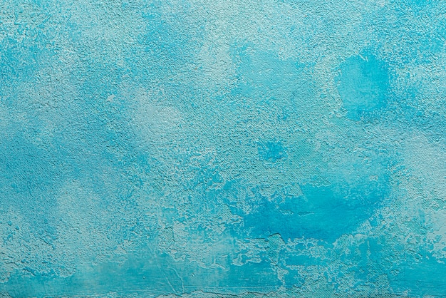 Abstract light blue plaster wall