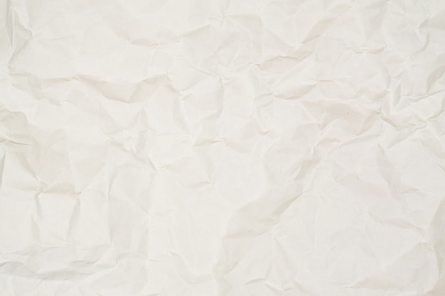 Abstract light brown white crumpled paper texture background