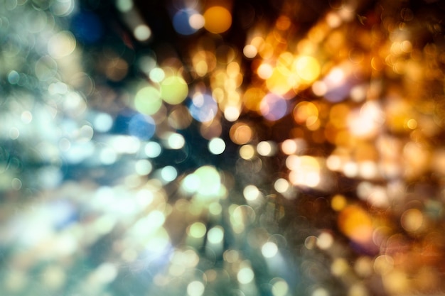 Abstract light celebration background with defocused golden lights for Christmas, New Year, Holiday, party