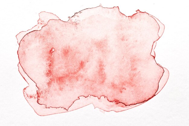 Abstract liquid art background Red watercolor translucent blots on white paper