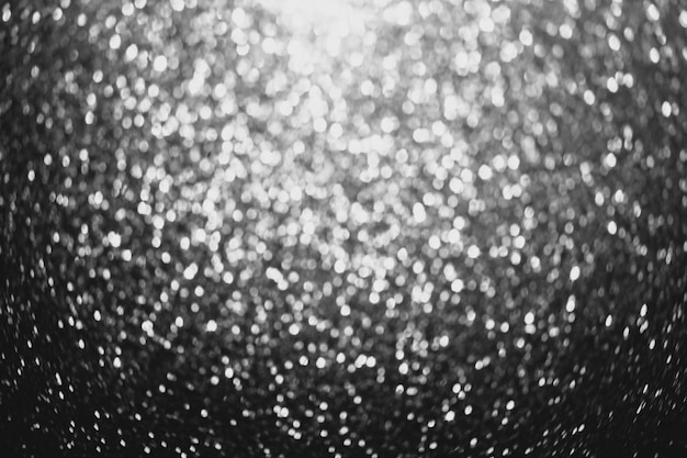 Photo abstract monochrome glitter background bokeh. elegant black and white background with glitter sparkle bokeh. defocus