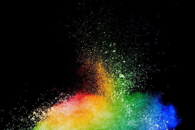 Abstract multi color powder explosion on black background.