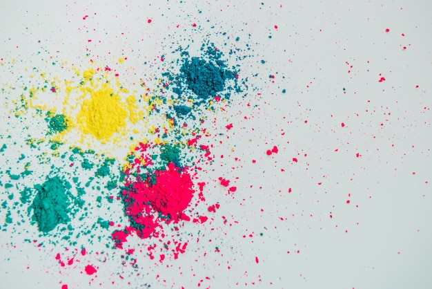 Abstract multicolor powder mixed on white background